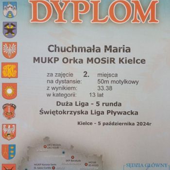 II miejsce na 50 m st. motylkowym